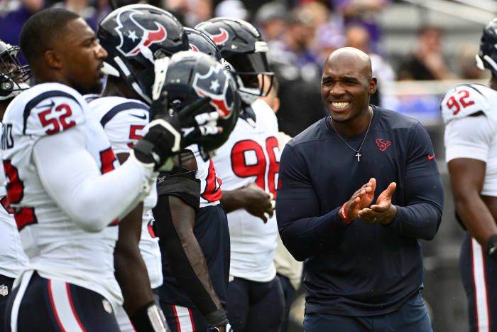 Houston Texans coach DeMeco Ryans (blue shirt) says it doesn’t mean anything to him that some fans left early in the team’s Week 9 win over the Tampa Bay Buccaneers.